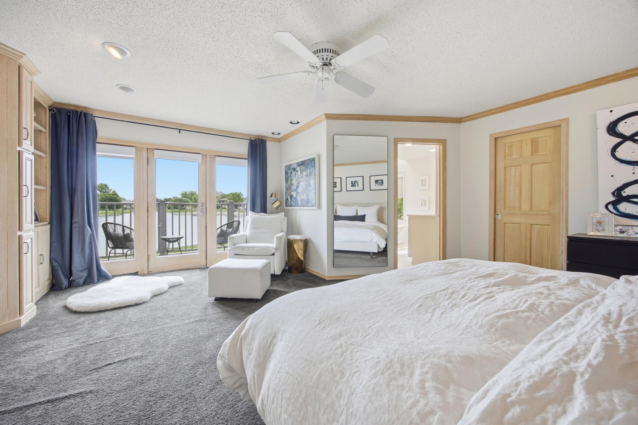 Main Floor Primary- Triple Door to Private Deck