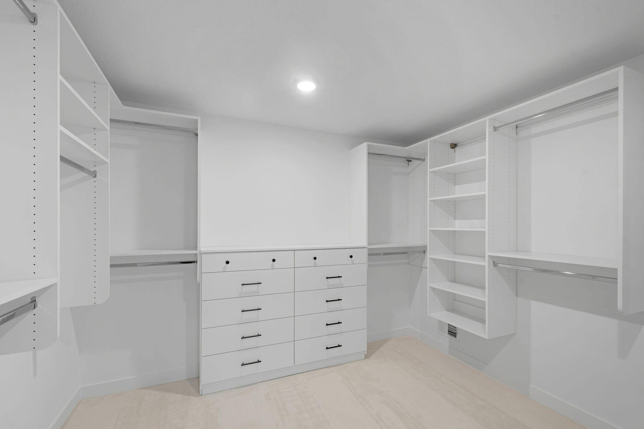 Owner's upgraded closet with built-ins