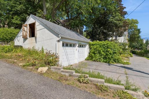 Two and a half car garage with loft. Note carriage doors to loft area.