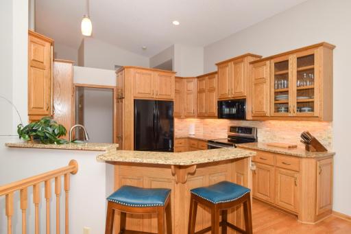Vaulted & Boasting Tall Custom Cabinetry w/Accent Lighting!