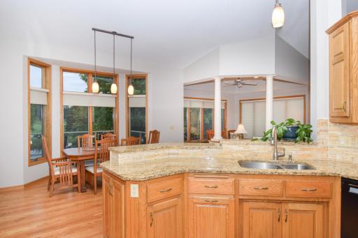 Warm Tones in Granite & Stone Backsplash Sure to Please!