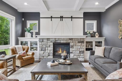 Custom cabinets, Stone fireplace, hidden TV
