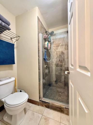 Primary en suite bathroom with tile shower.