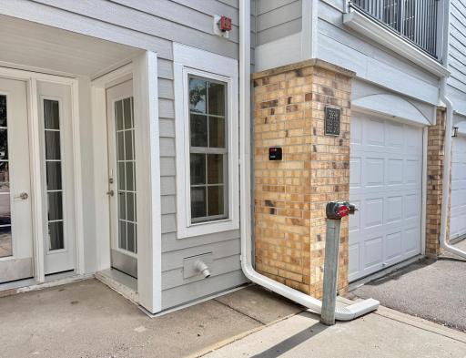 Private entry is the door on the right. Attached garage is pictured here.
