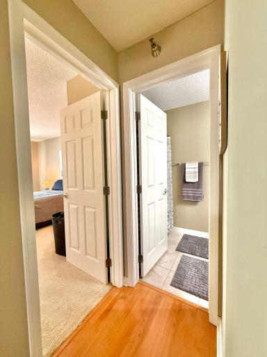 To the right of the entry door: bedroom #2 & the full bathroom