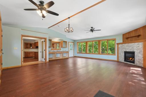 Large family room over the tuckunder garage. Nice open space with tons of windows and a cozy gas fireplace.