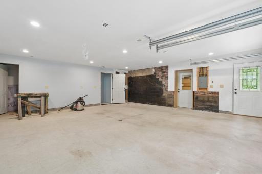 Newer attached tuckunder garage has access to the basement and separate stairs up to the family room.