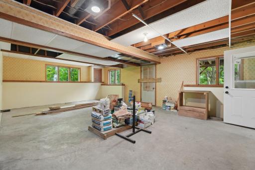 This lower-level space could easily be converted into an apartment with a separate entrance and two options for garage parking.