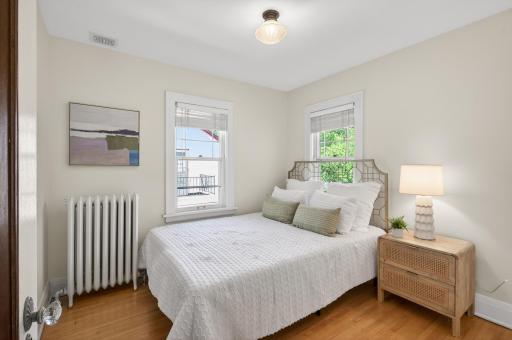 Spacious third upper-level bedroom offering flexibility for family or guests.