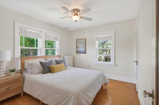 Comfortable secondary bedroom filled with natural light.