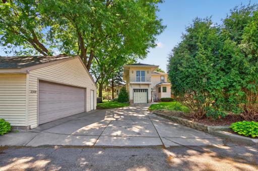 Rare combination of an attached one-car garage and detached two-car garage.