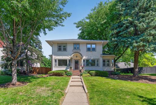Classic architecture and timeless curb appeal welcome you home along iconic St. Anthony Parkway.
