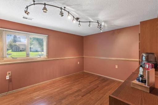 Spacious 4th Bedroom, laminate wood flooring, track lighting.