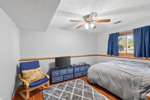 5th Bedroom, laminate wood flooring, ceiling fan.