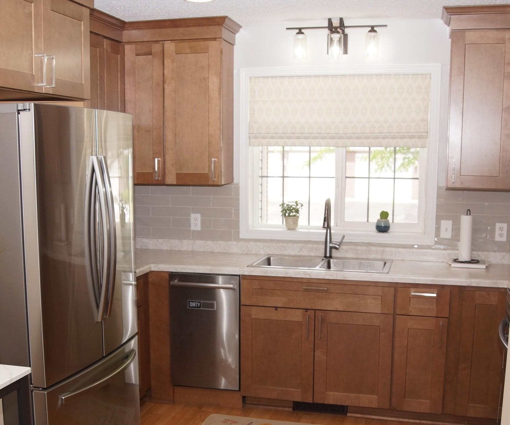 Updated kitchen features new cabinets, stainless steel appliances and newer laminate flooring throughout. All appliances are included, Refrigerator, Double Oven, Dishwasher, Washer, and Dryer, plus a Touch Kitchen Faucet! Making this move-in ready.