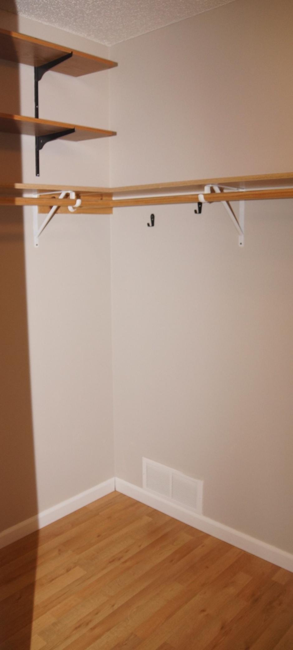 Bedroom 1 has a large walk-in closet. 3 pictures to show complete closet.
