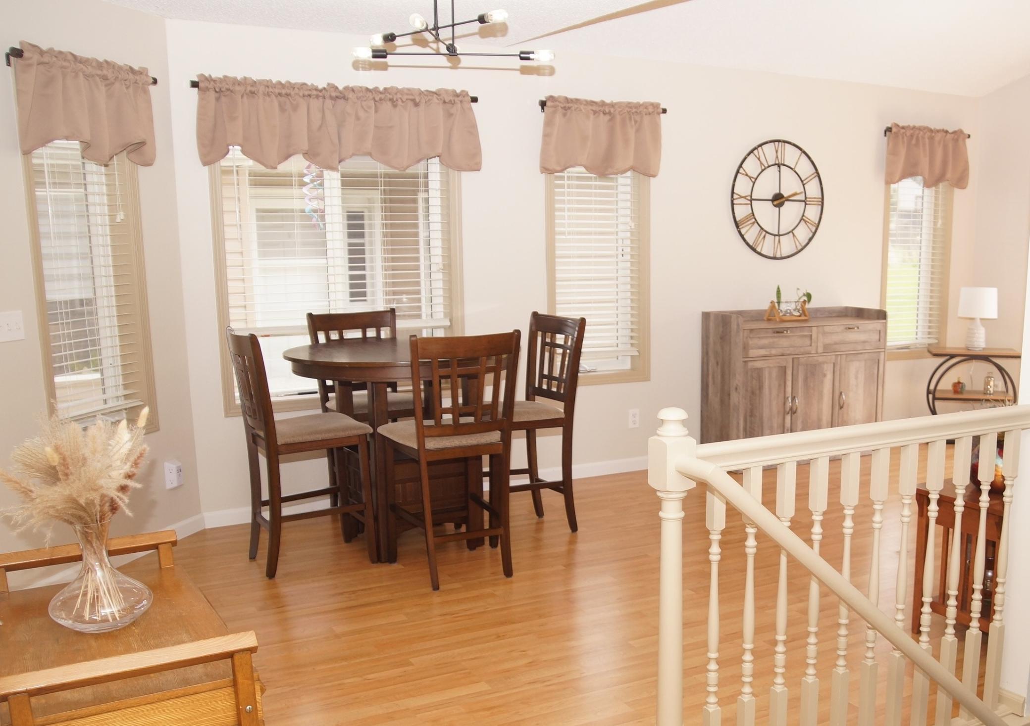 Dining area between kitchen and living room with newer laminate flooring!
