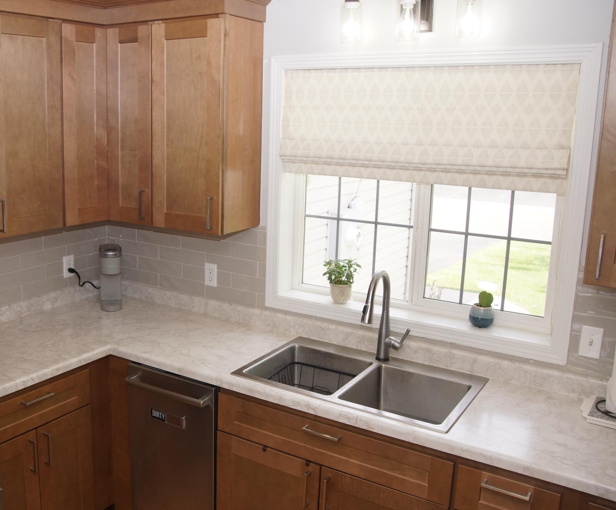 Updated kitchen features new cabinets, stainless steel appliances and newer laminate flooring throughout. All appliances are included, Refrigerator, Double Oven, Dishwasher, Washer, and Dryer, plus a Touch Kitchen Faucet! Making this move-in ready.