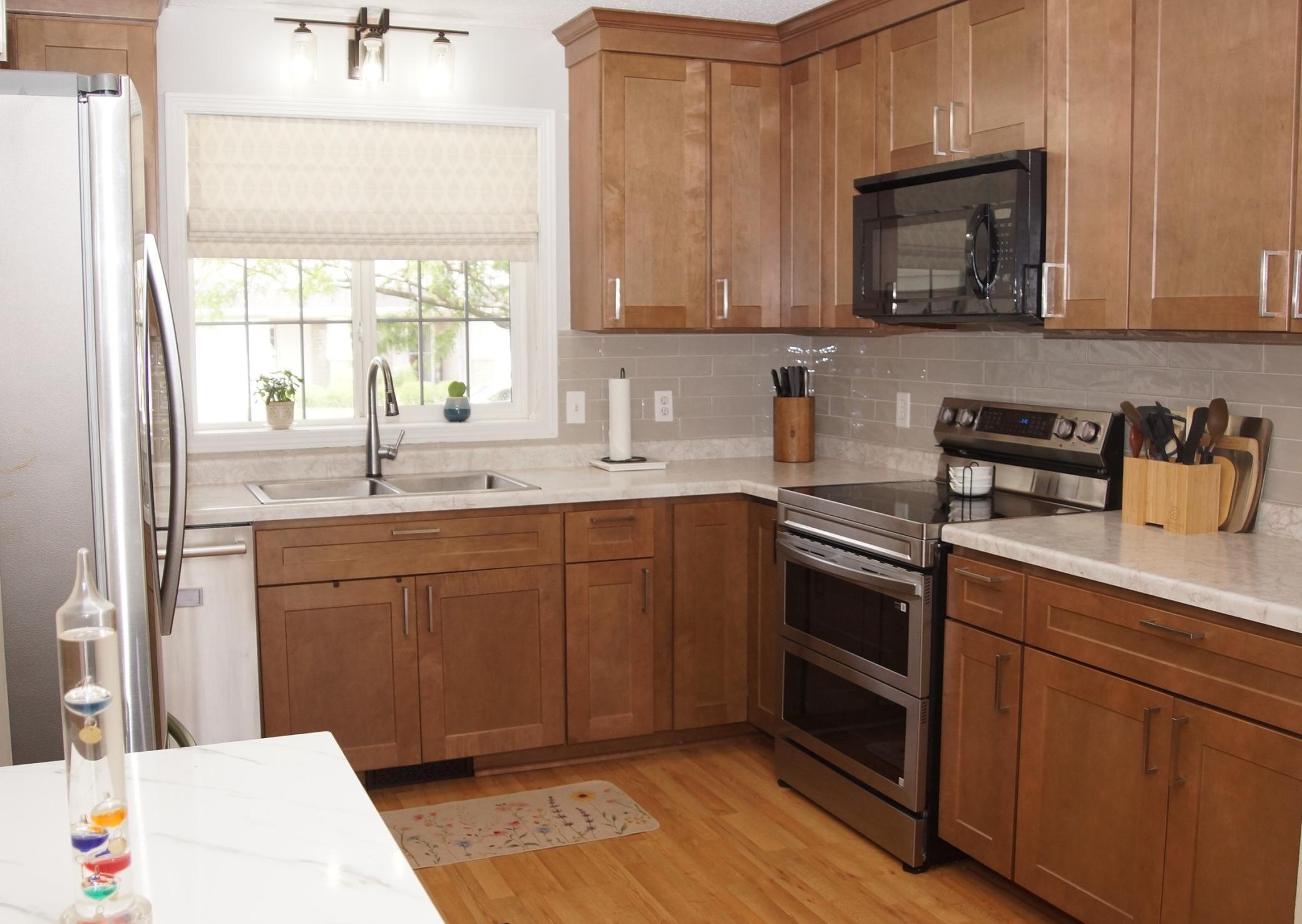 Updated kitchen features new cabinets, stainless steel appliances and newer laminate flooring throughout. All appliances are included, Refrigerator, Double Oven, Dishwasher, Washer, and Dryer, plus a Touch Kitchen Faucet! Making this move-in ready.