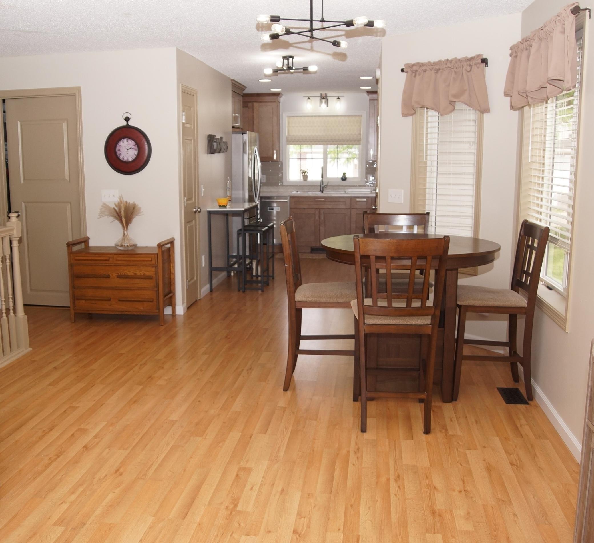 Dining area between kitchen and living room with newer laminate flooring!