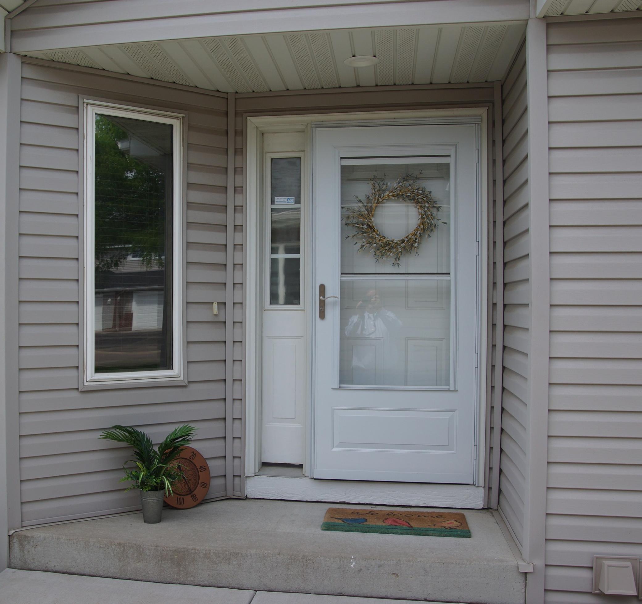Townhome features covered entry for you guests!