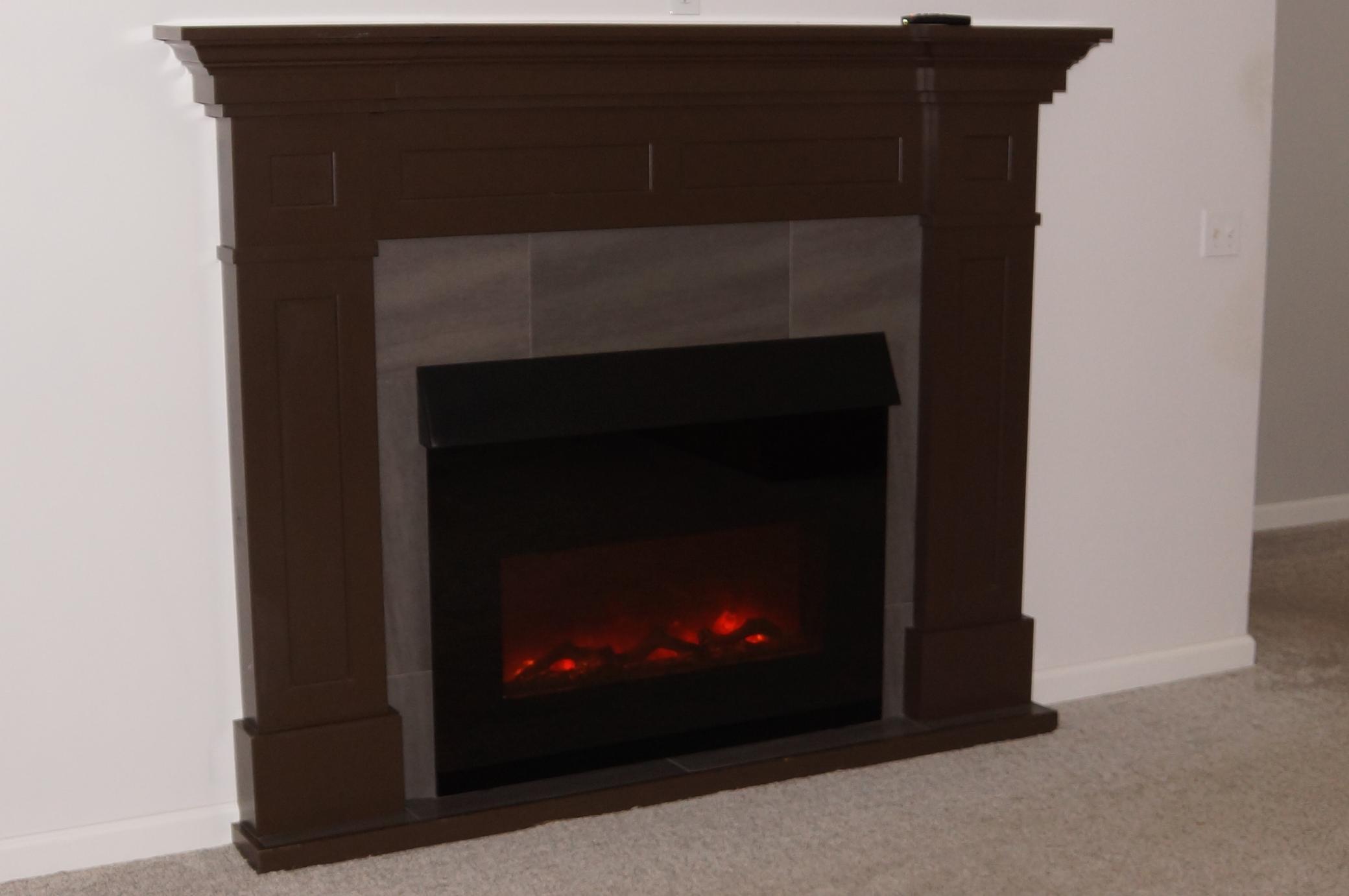 Electric fireplace in lower level. see statement of condition.