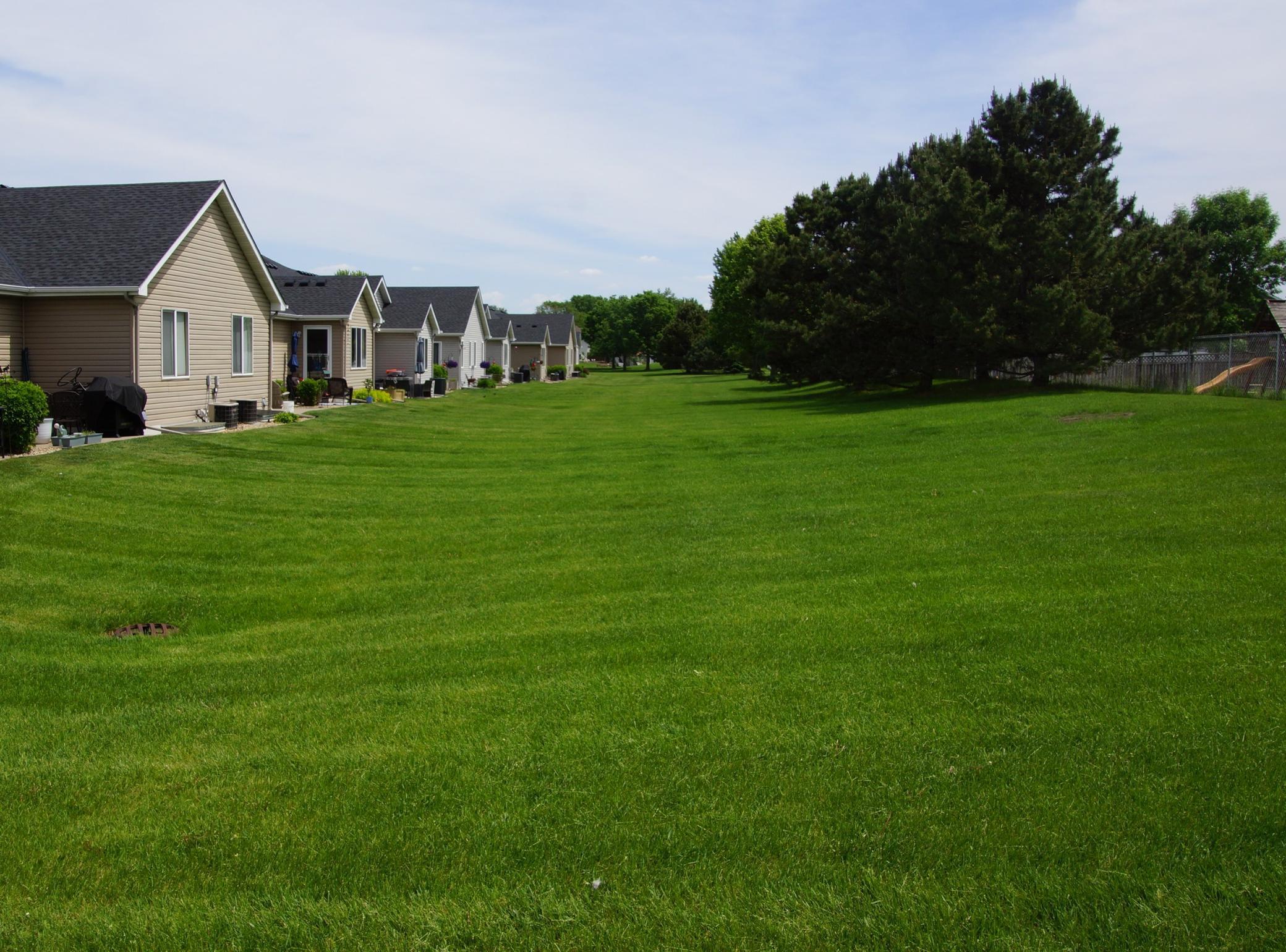 Huge private green space behind back row of townhomes in this complex!