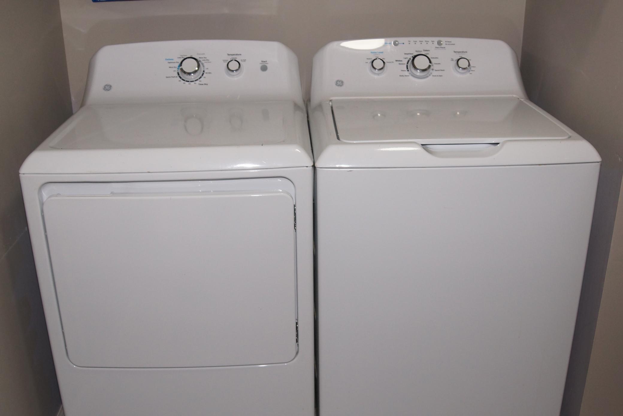 Townhome features main floor laundry room / mud room between garage and kitchen. Washer and dryer stay!