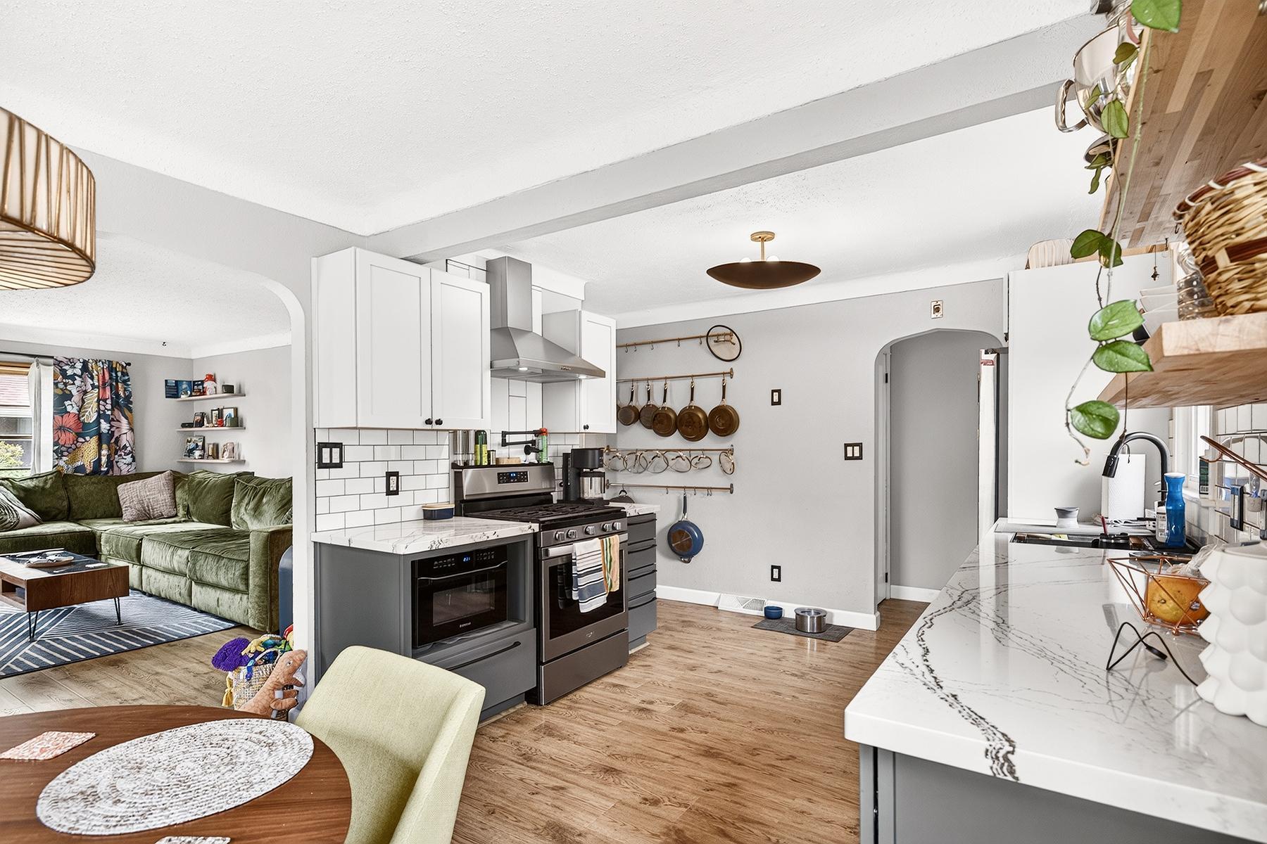 Kitchen is bright and open with newer appliances and finishes
