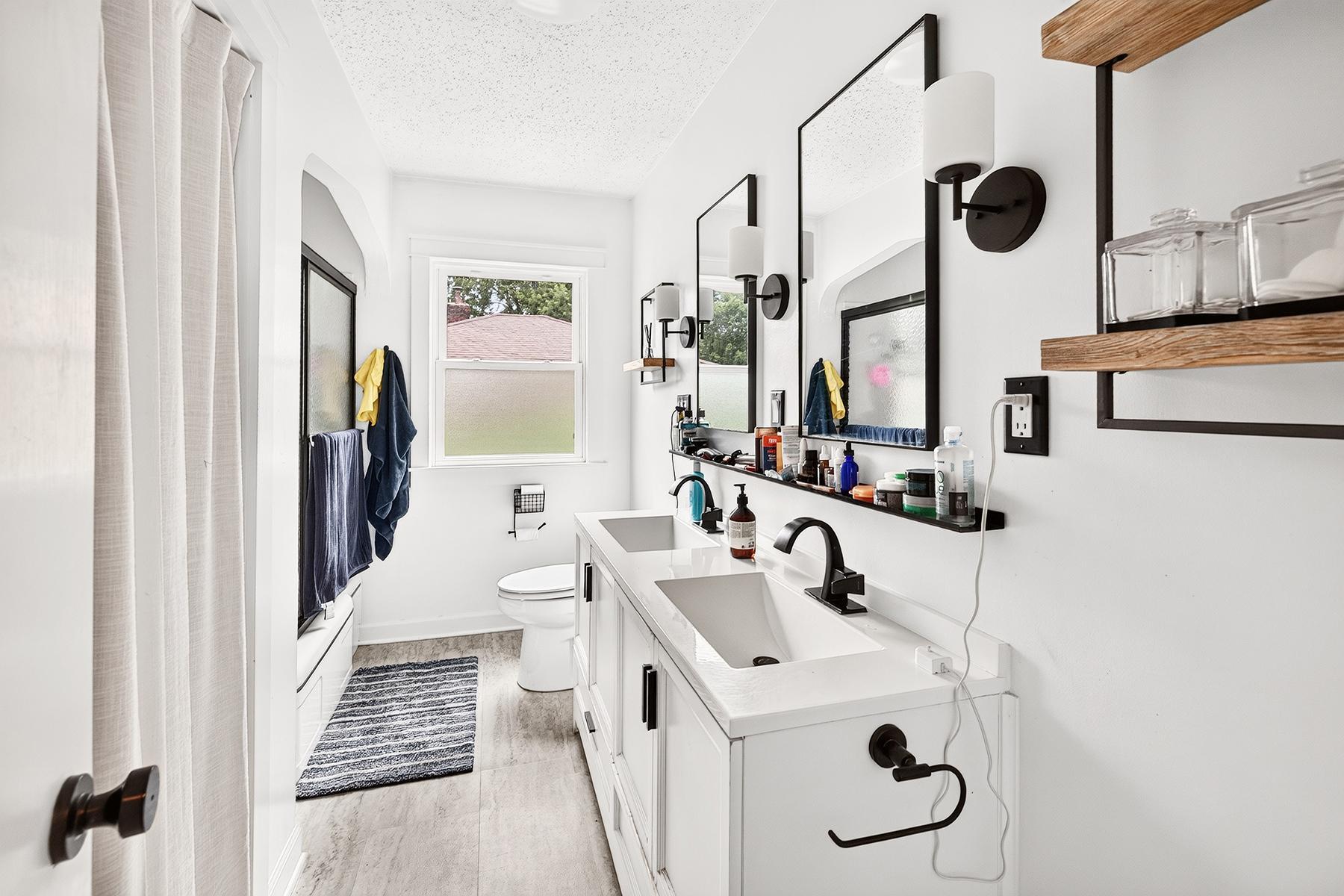 Fully remodeled main level bathroom with dual vanity
