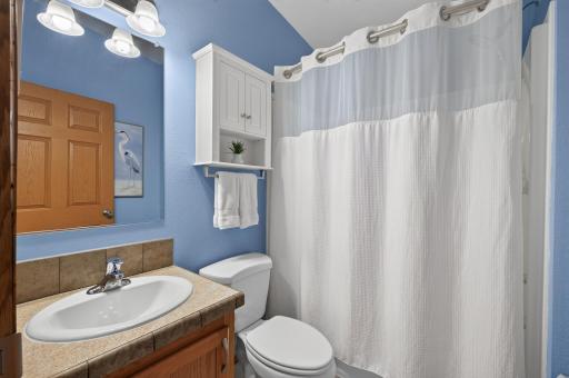 A main level bathroom is convenient to all living spaces, making it ideal for guests and everyday use.