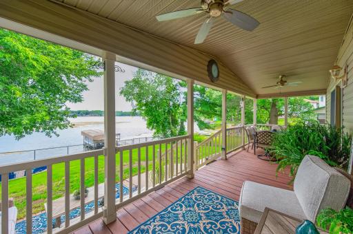 Step onto the lakeside covered porch to enjoy peaceful water views, spectacular sunrises, and relaxing mornings by the lake.