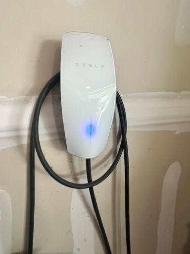 Electric car charging station in garage