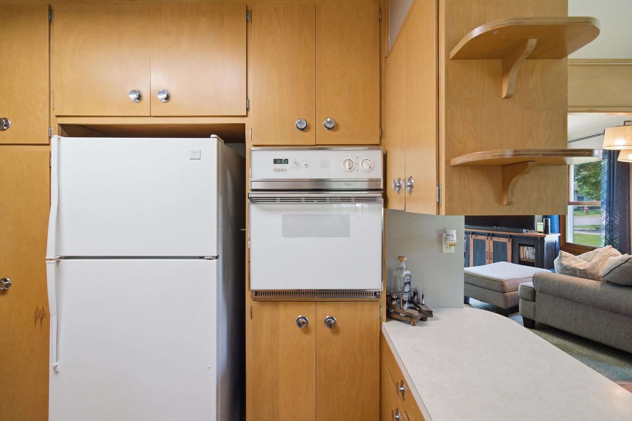 Enjoy cooking in this bright, functional kitchenwith abundant cabinet space and a practical layout.