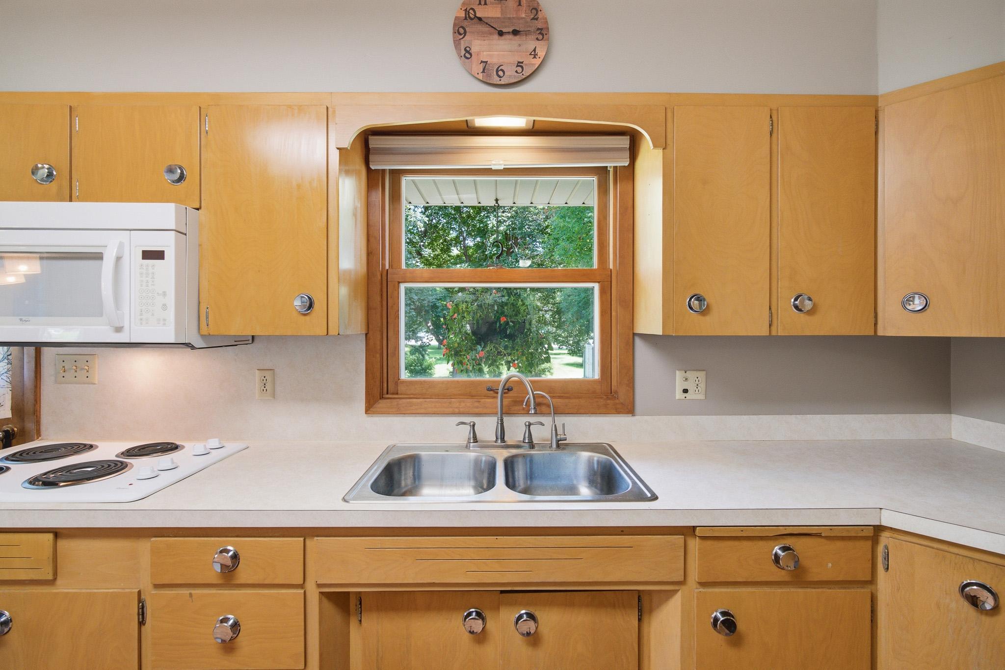 Spacious kitchen offers abundant storage, generous workspace, and an easy access to the dining area.