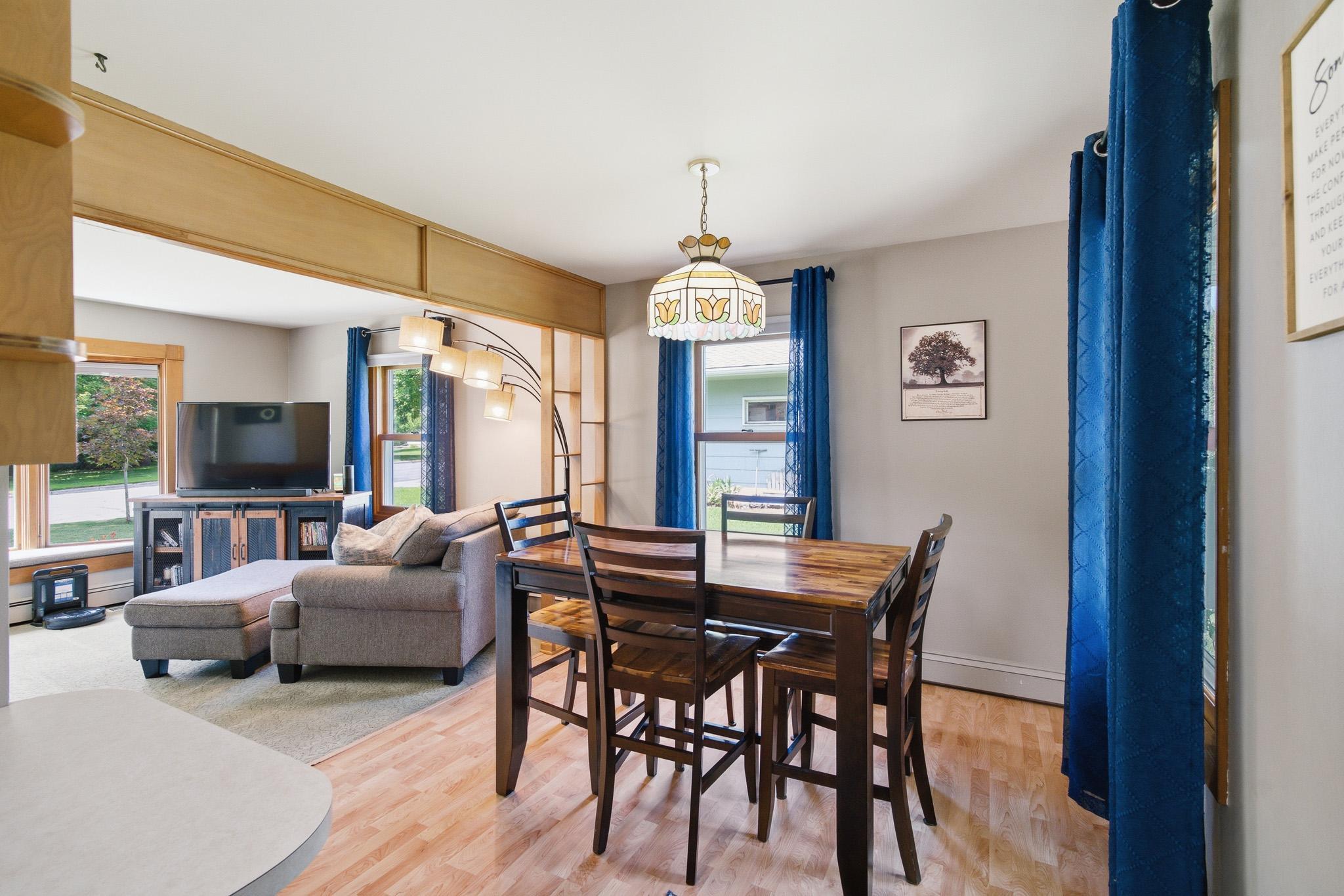 Bright dining area with abundant natural light and an opeen flow to the living room- perfect for everyday living and entertaining.