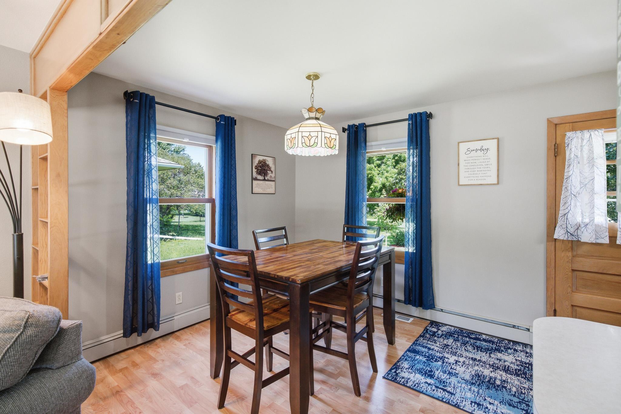 Bright dining area with plenty of natural light and an open flow to the spacious living room.