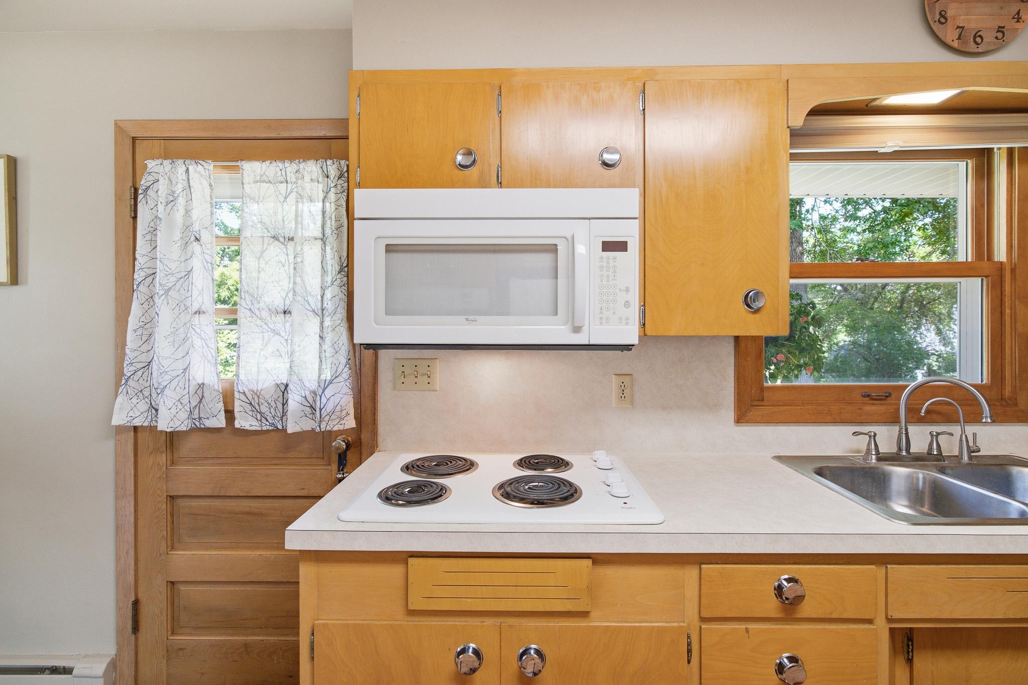 Well designed kitchen with ample cabinetry, built in storage, and plenty of prep space.