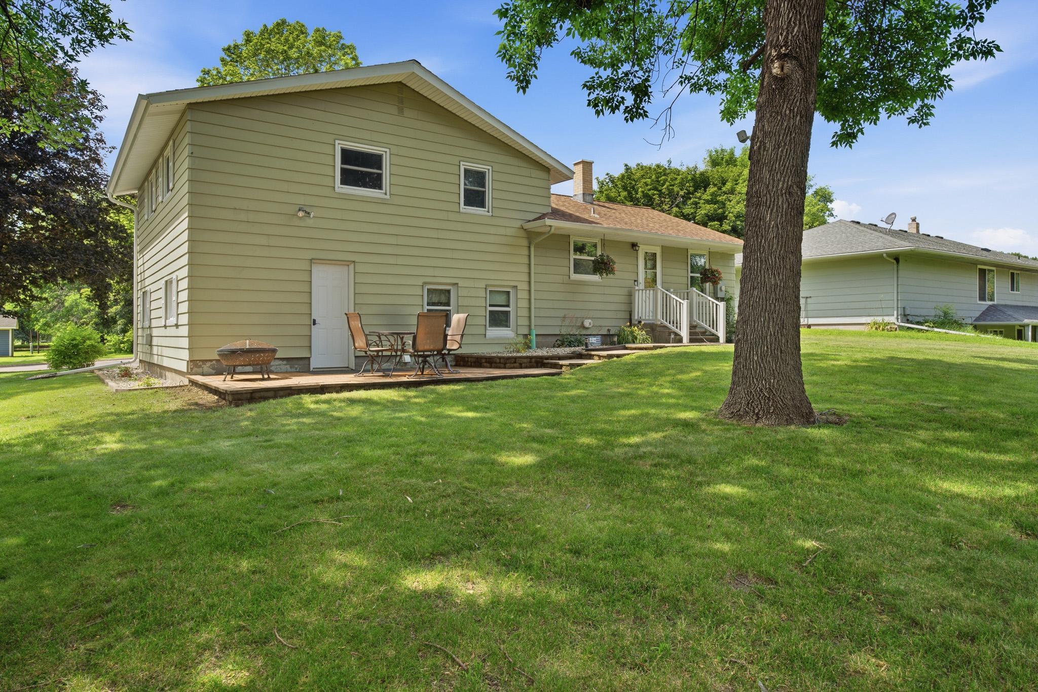 Beautiful backyard with a generous patio and plenty of green space for outdoor enjoyment.