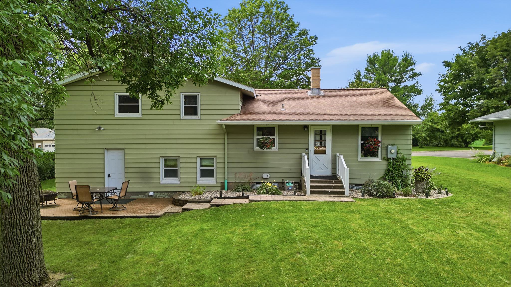 Back yard with patio off garage
