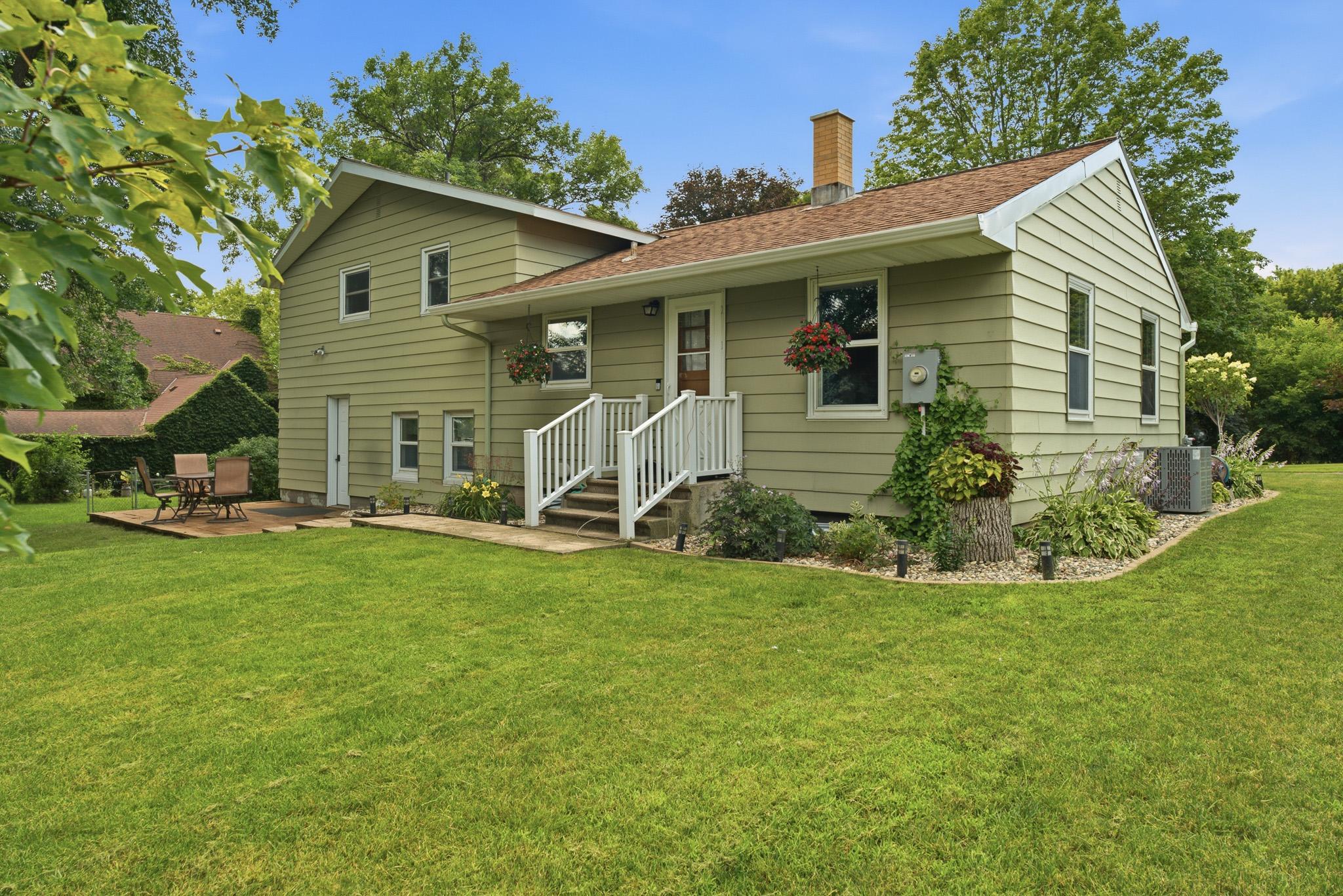 Step outside to a large, beautifully maintained backyard with a patio ideal for gatherings.