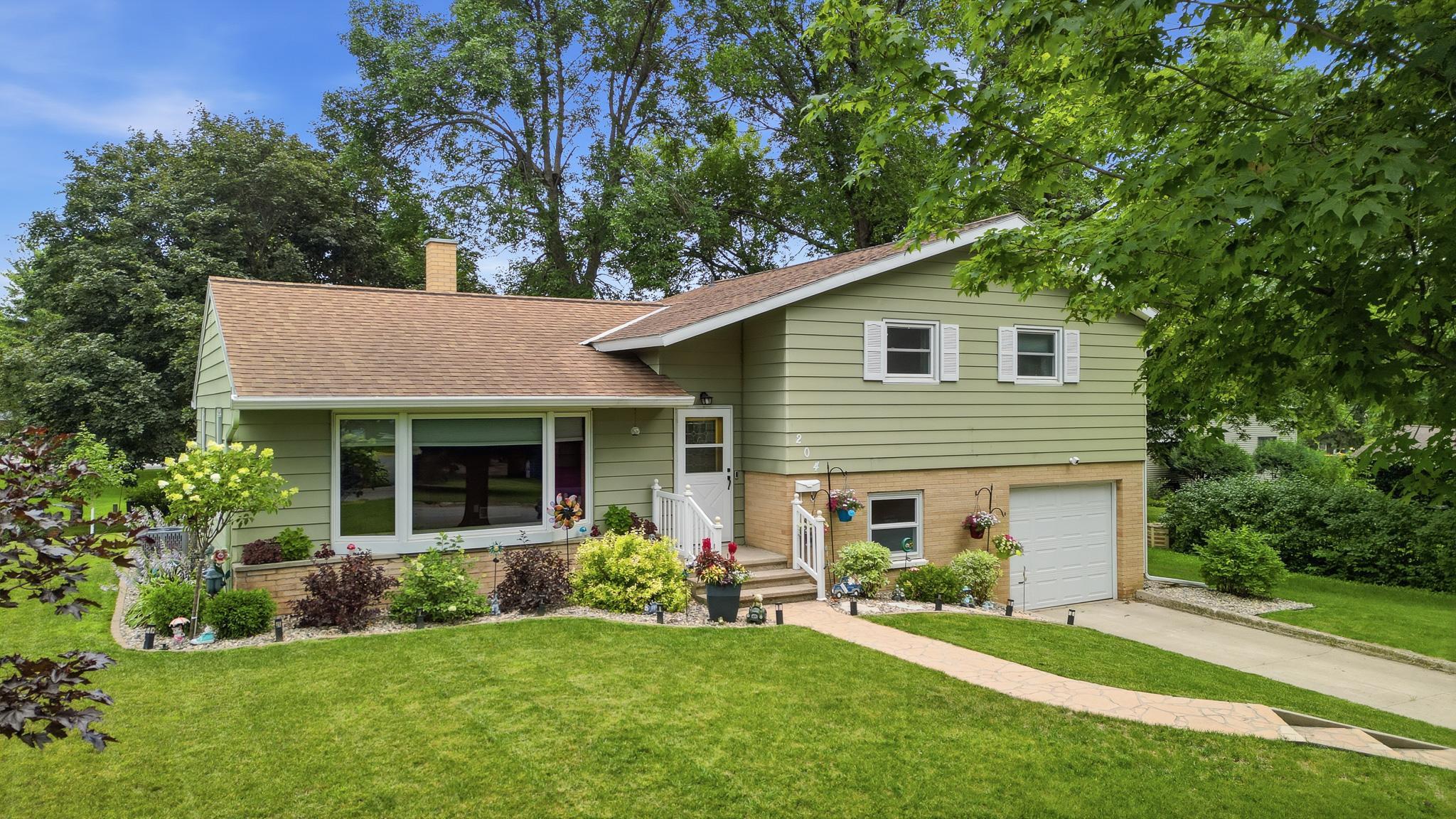 Front of home beautifully landscaped