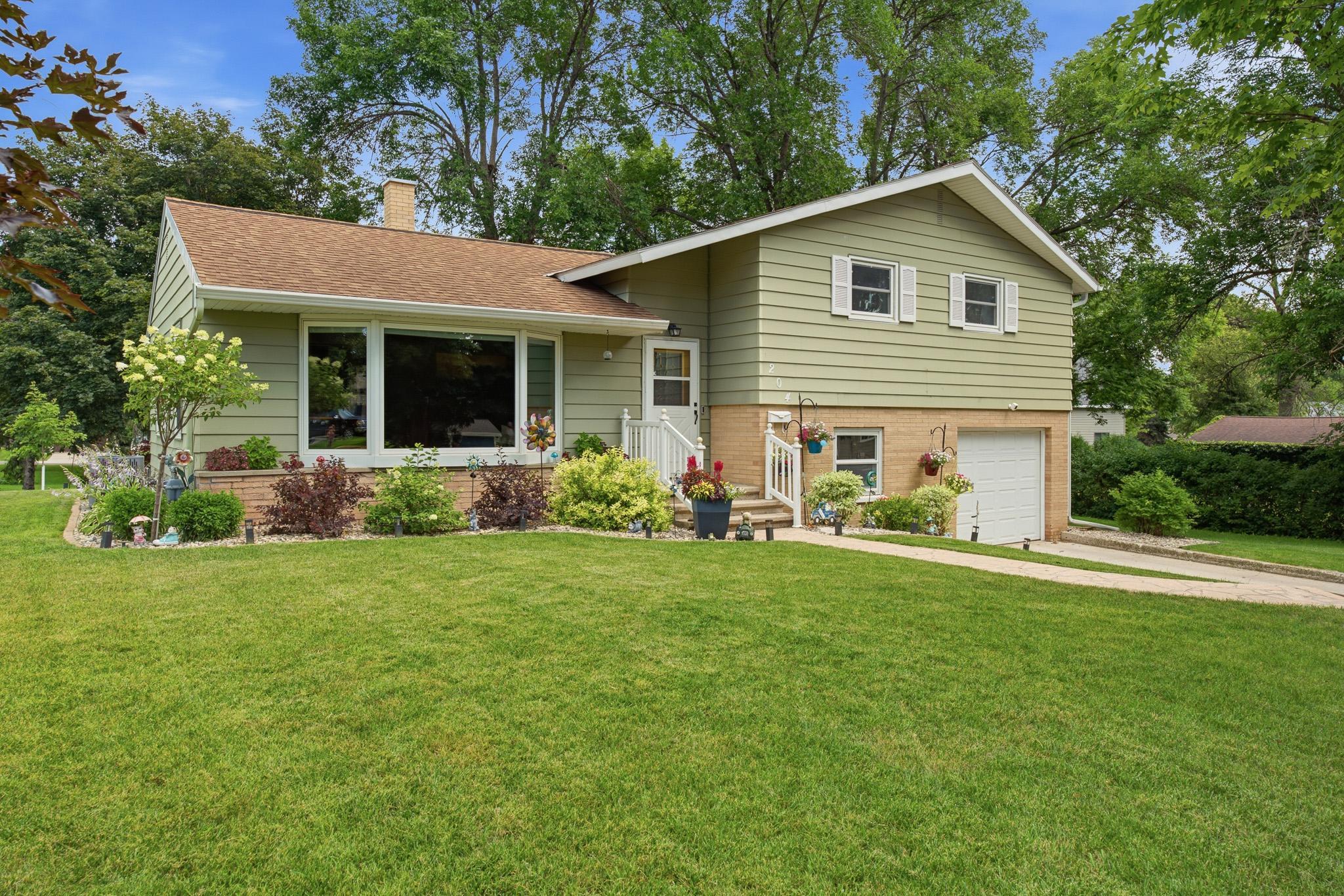 Pride of ownership shines throughout this well-maintained home with stunning curb appeal and a beautifully manicured yard.