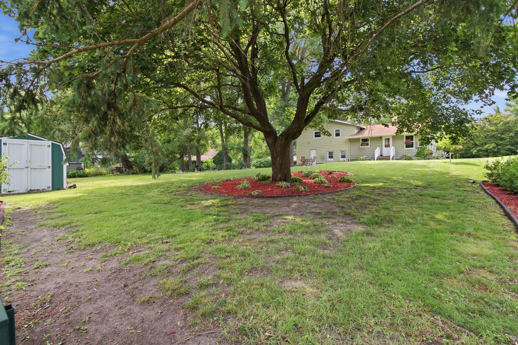 Expansive backyard offers plenty of room to play, garden, or simply unwind on the patio. newly landscaped