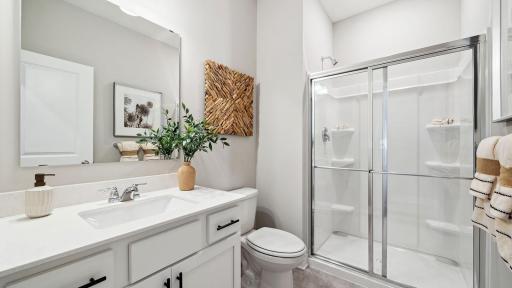 Main floor 3/4 bathroom. Photo of model home, colors and finishes may vary.