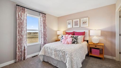 All three upper bedrooms have large windows and walk-in closets. Photo of model, colors and finishes may vary.
