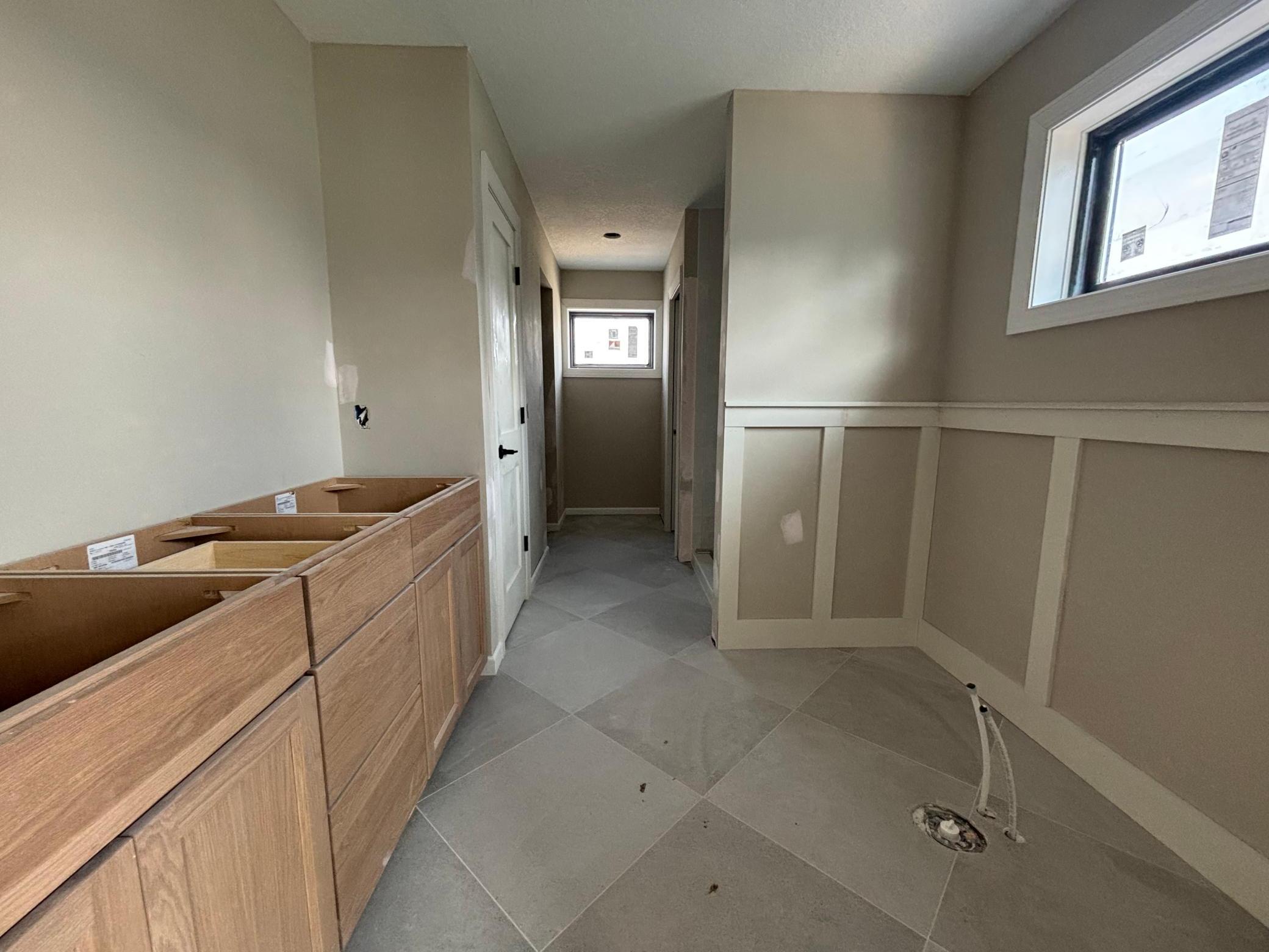 Primary Owners Bathroom - Features freestanding soaking tub, walk-in shower, walk-in closet, and private water closet