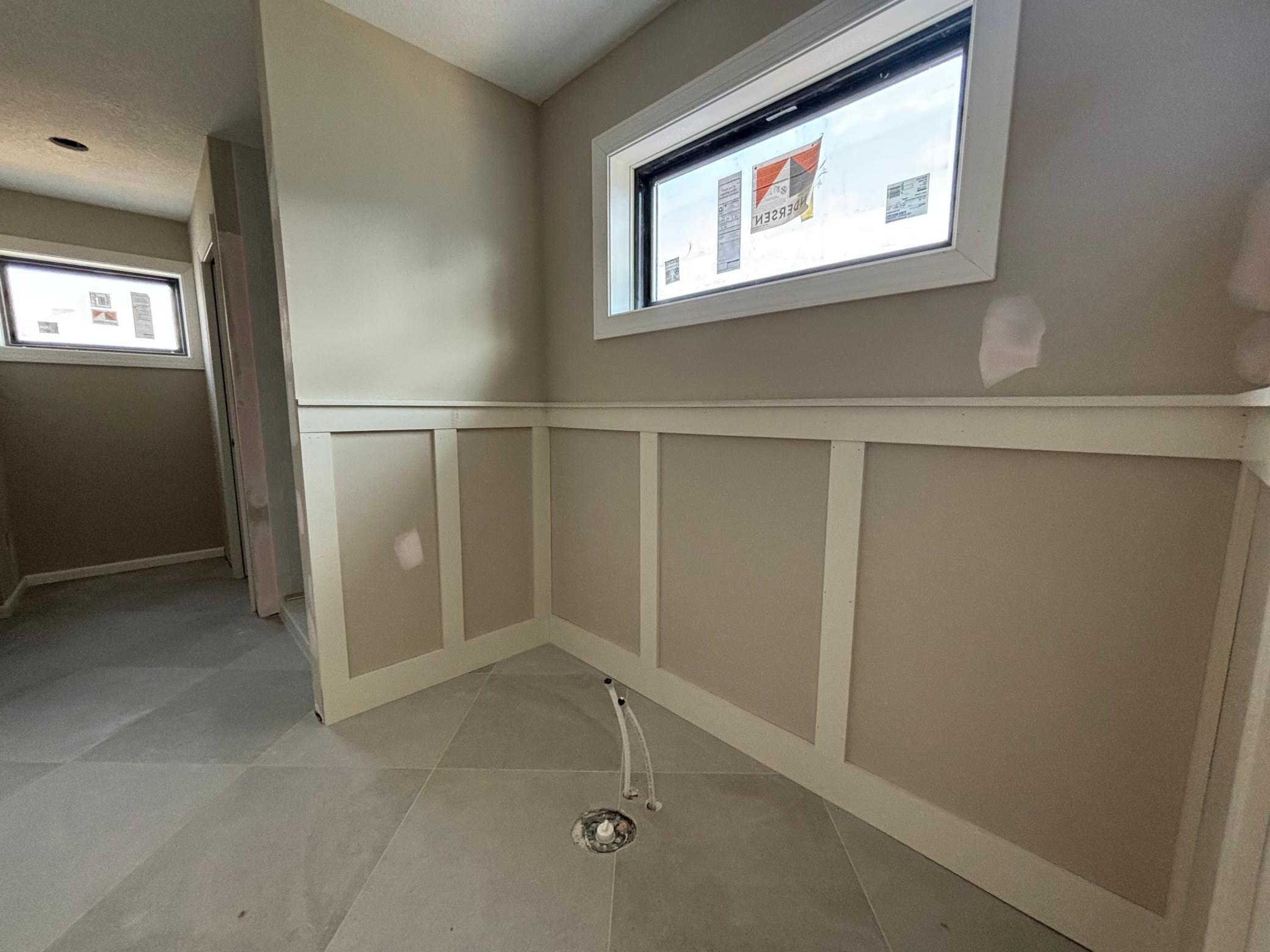 Wainscoting details around the soaking tub