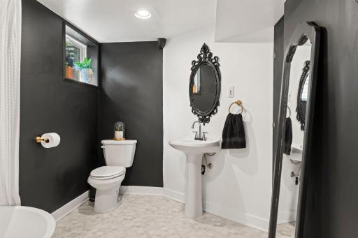 Lower level bathroom with pedestal sink