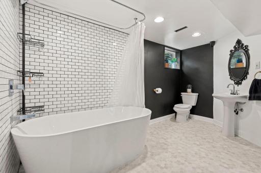 Lower level bathroom with classic subway tile